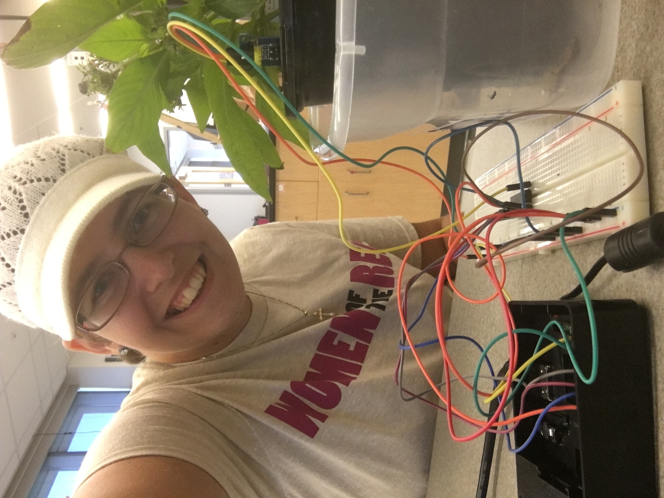 Becca with a wired plant